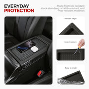 Black rubber center console organizer tray with a smartphone and wireless earbud case.