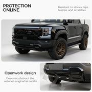 Black 4x4 truck with durable front bumper protection and custom bronze rims.