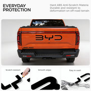 Black anti-scratch ABS protective trim for BYD pickup truck tailgate.