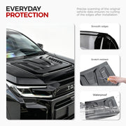Black 4x4 vehicle protection film showing scratch-resistant, waterproof, and smooth edge features.