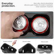 Non-slip silicone cup holder coasters in a vehicle with two red soda cans.
