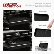 Black rubber car console tray with smooth edges, scratch-resistant surface, and easy-to-wash design.