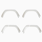 Set of four white automotive fender flares for 4x4 vehicle wheel arch protection.