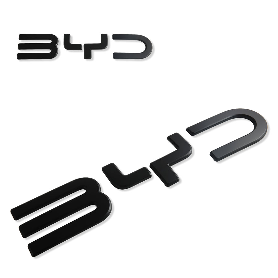 Two black glossy BYD car emblems on a white background.