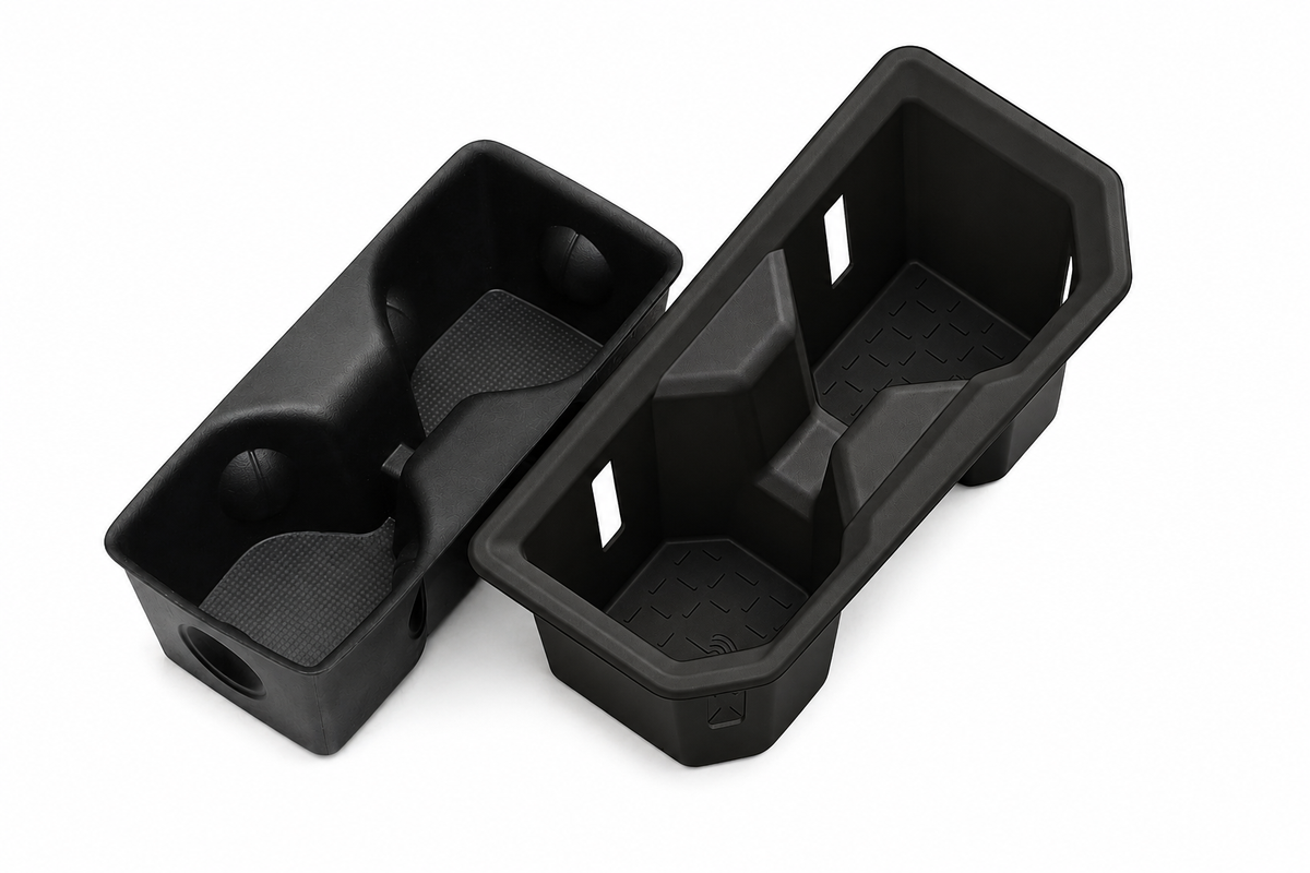 Black heavy-duty 4x4 vehicle interior organizer trays and storage compartments.