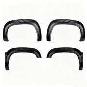 Set of four black matte 4x4 vehicle fender flares for off-road wheel protection.