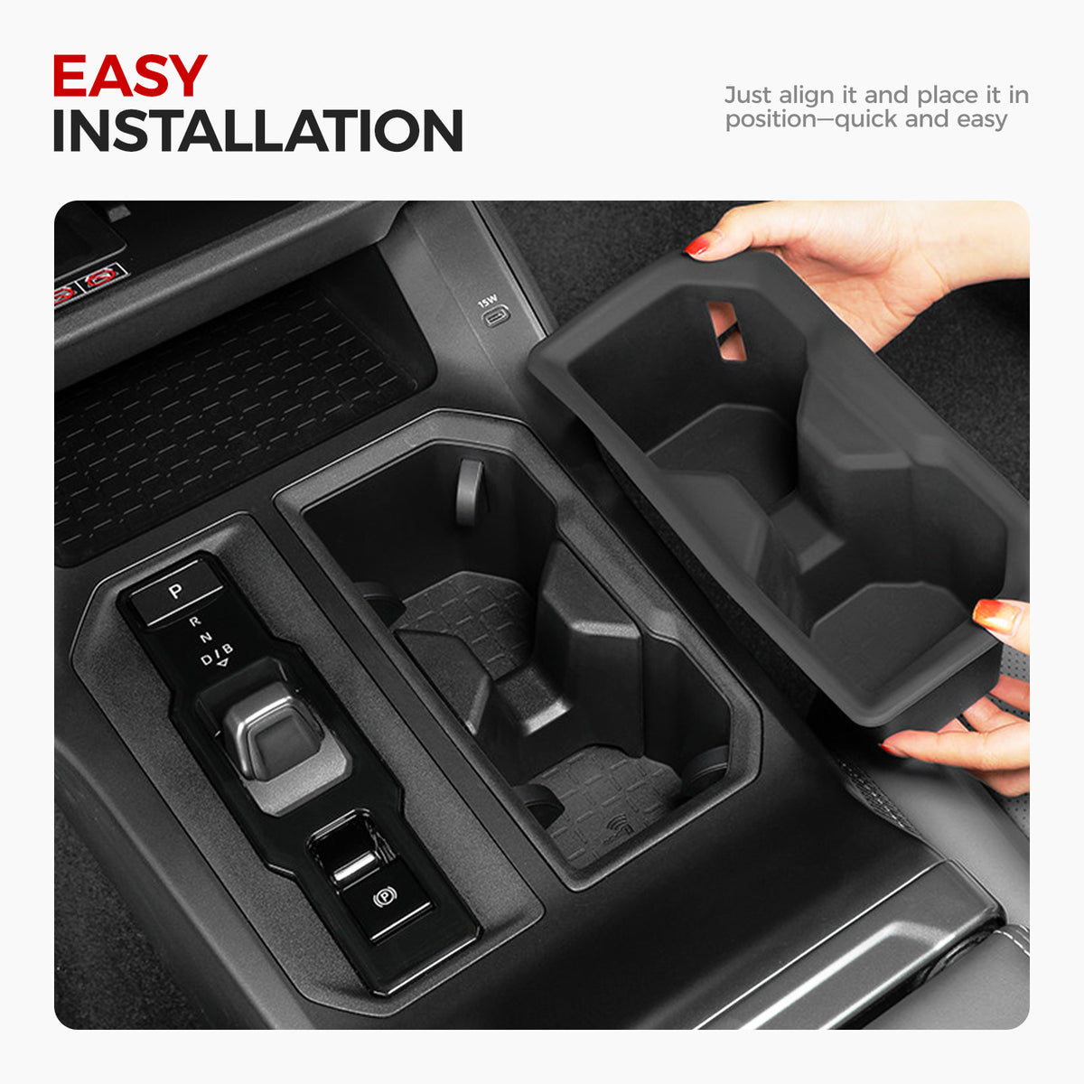 Hands installing a black custom-fit center console organizer into a vehicle cup holder.