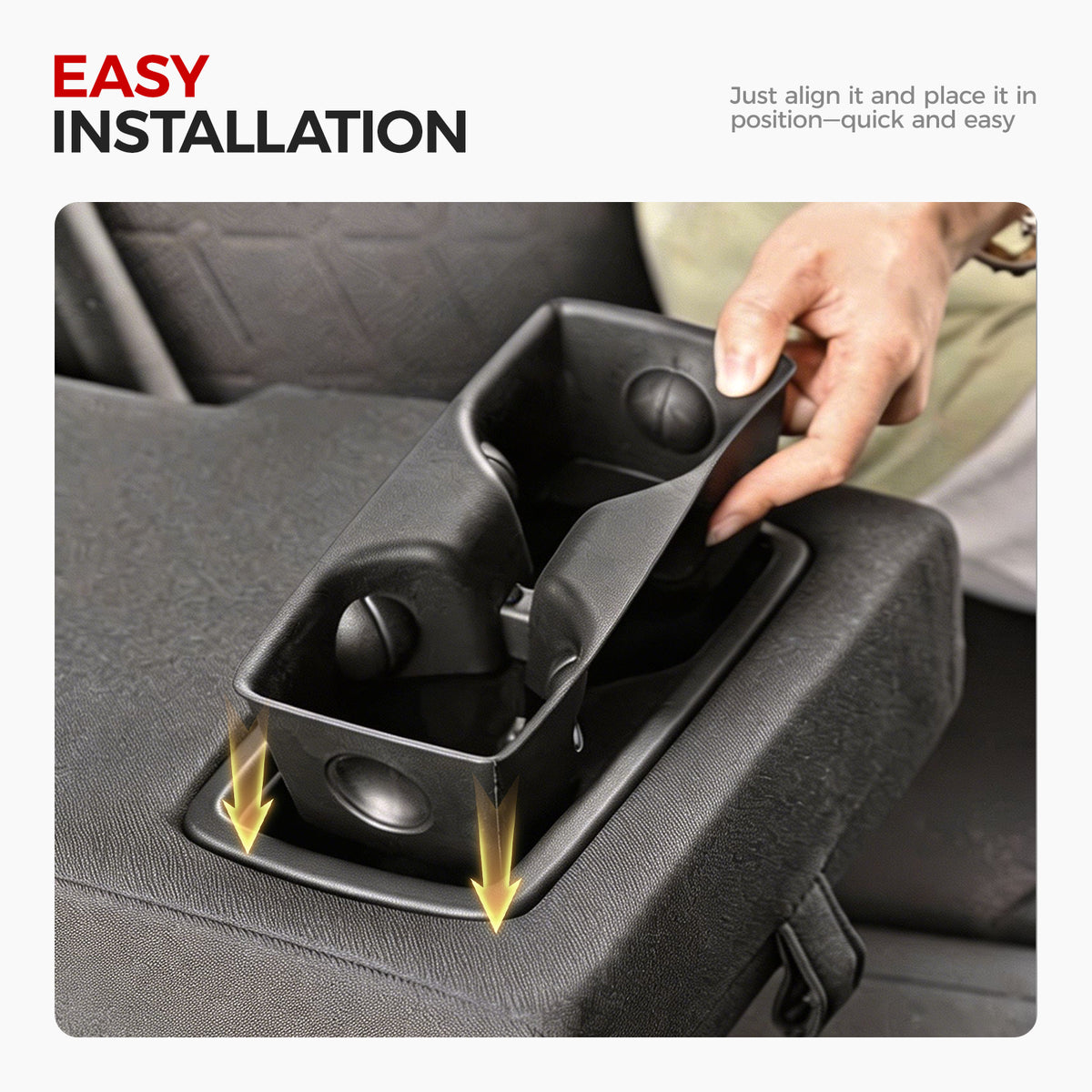 Installing a black 4x4 vehicle center console cup holder into a truck seat compartment.