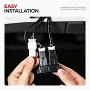 Hands connecting plug-and-play electrical connectors for easy 4x4 vehicle accessory installation.