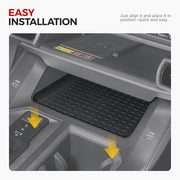Black rubber center console tray liner installed in a vehicle interior for easy protection.