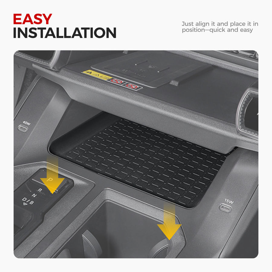 Black rubber center console tray liner installed in a vehicle interior for easy protection.