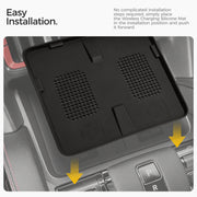 Wireless charging silicone mat being installed in a vehicle center console.