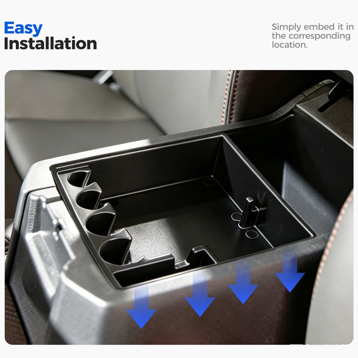 Black plastic vehicle center console organizer being installed into a car interior.
