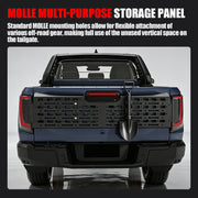 Black MOLLE multi-purpose storage panel mounted on a blue 4x4 truck tailgate with a shovel.
