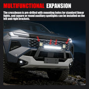 Off-road vehicle front bumper with mounted LED light bar and auxiliary spotlights.