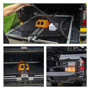 Black cargo net securing gear in a 4x4 truck bed for off-road vehicle protection.