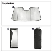 Foldable silver sunshade for vehicle windshield, shown unfolded, folded, and in a storage bag.