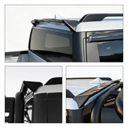 Black roof spoiler and window visors installed on a white 4x4 vehicle.