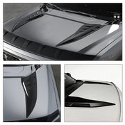 Black aerodynamic hood vents and air scoops for 4x4 vehicle performance and styling.
