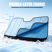 Double-layer blue car windshield sunshade with UV protection and heat insulation on snow.