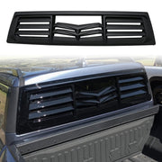 Black slotted rear window louvers installed on a silver pickup truck bed
