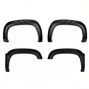 Set of four matte black heavy-duty 4x4 vehicle fender flares for off-road protection.