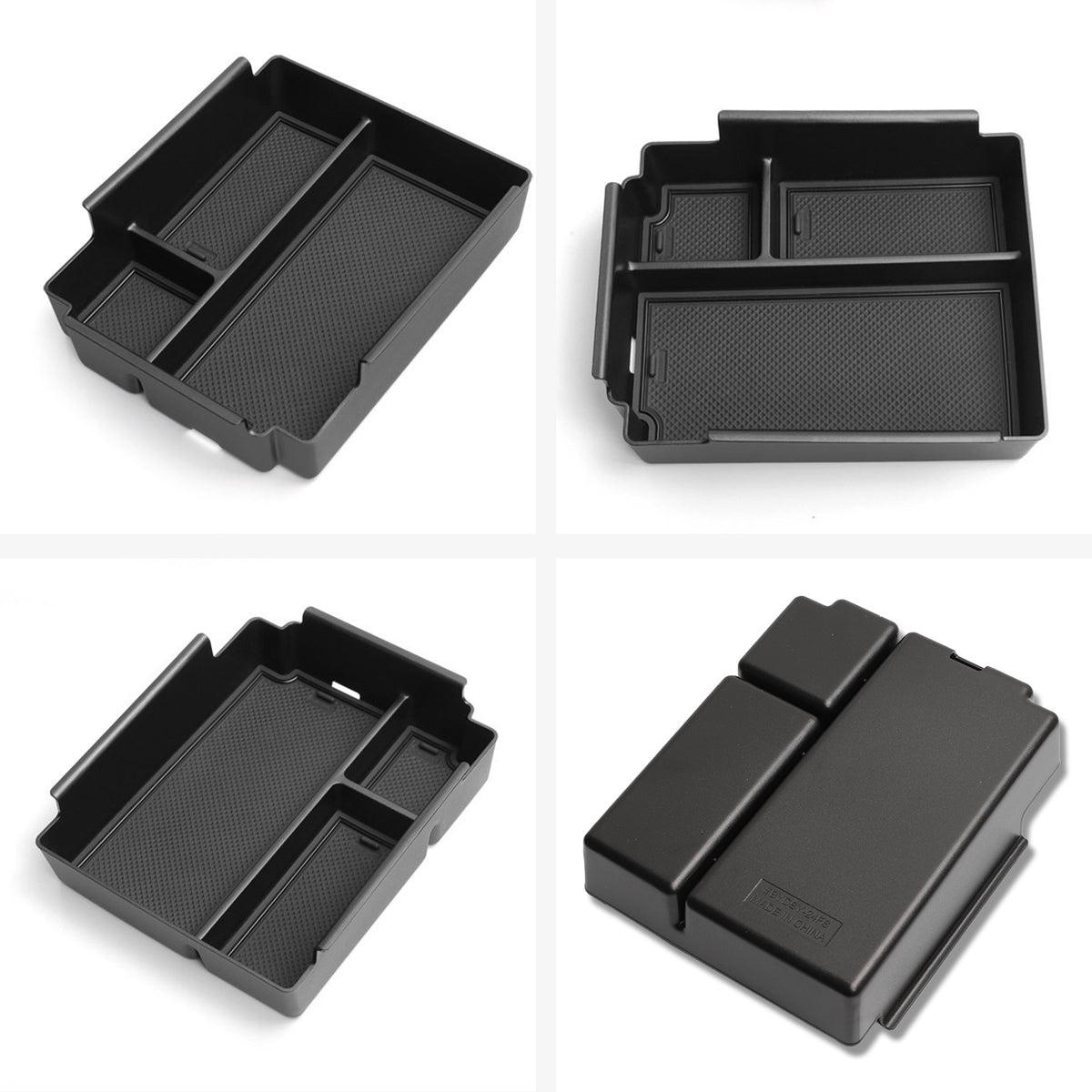 Black plastic vehicle center console organizer tray with multiple compartments.