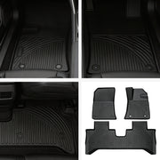 Set of heavy-duty black rubber car floor mats with deep grooves for vehicle protection.