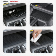 Black rubber car console tray liners for vehicle interior protection and organization.