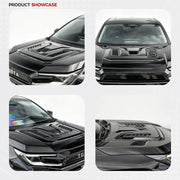 Black 4x4 vehicle with a custom performance hood scoop and vent accessory.