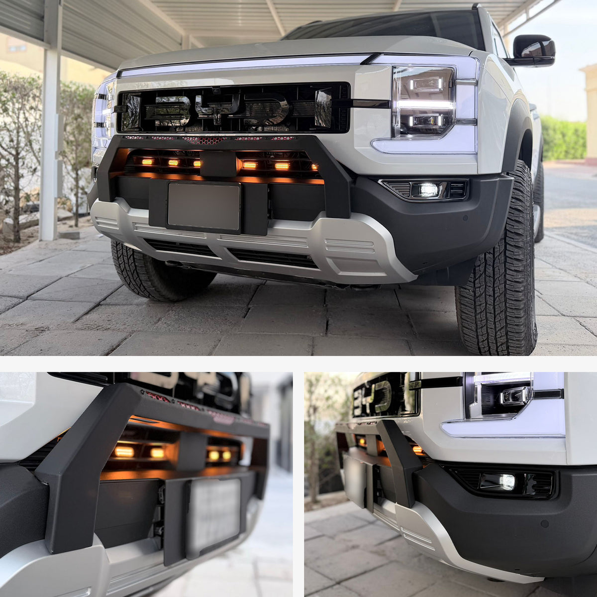 Front view of a white 4x4 truck featuring a heavy-duty black bumper with integrated amber LED lights.