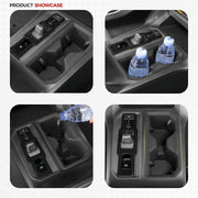 Black 4x4 vehicle center console organizer with cup holders and gear shifter compartment.