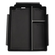 Black durable plastic vehicle center console organizer tray with textured inserts