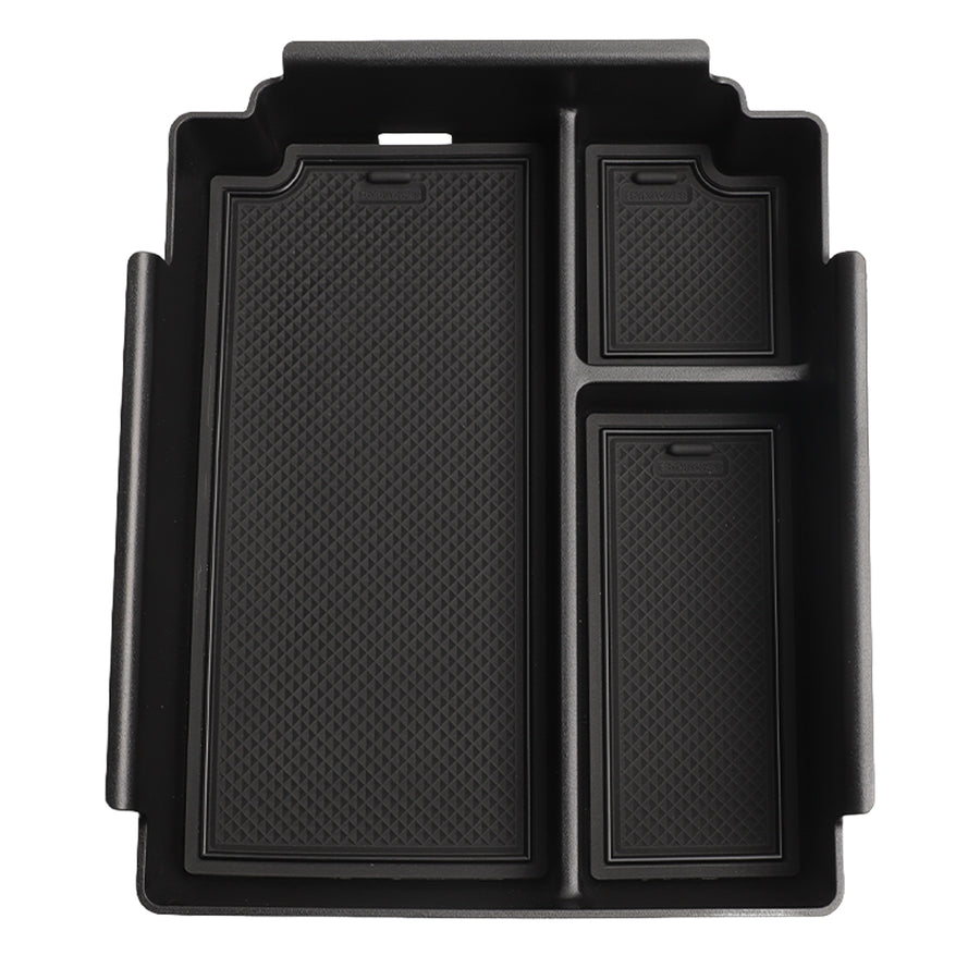 Black durable plastic vehicle center console organizer tray with textured inserts